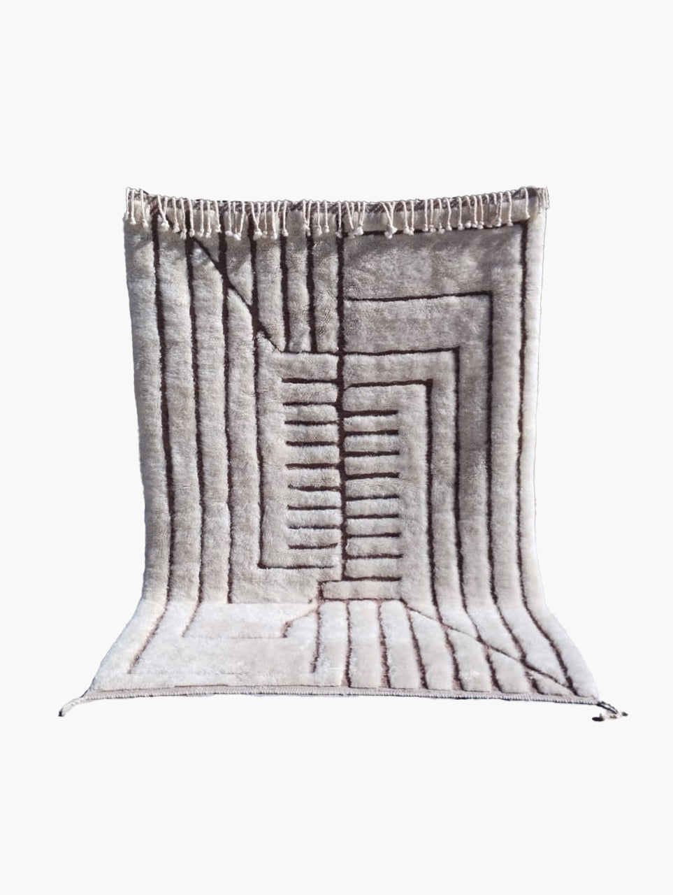 A rectangular wool rug with a geometric pattern, featuring natural colors and a fringed edge.